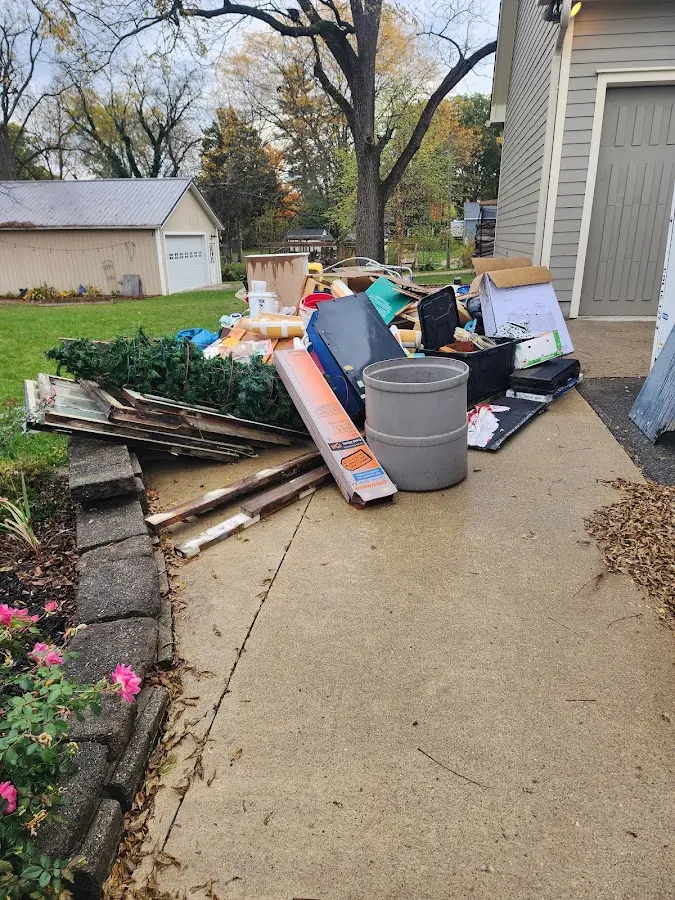 Dumpster being loaded with debris for 30 Yard Dumpster Rental in Seymour